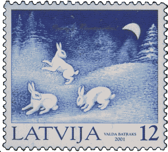 A stamp featuring three hares in a snowy forest under a deep blue sky.
