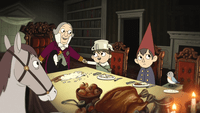 Wirt, Greg, Beatrice, and Fred the horse sitting at Quincy Endicott's table. Endicott and Greg are getting along like a house on fire, but everyone else seems bored or annoyed.