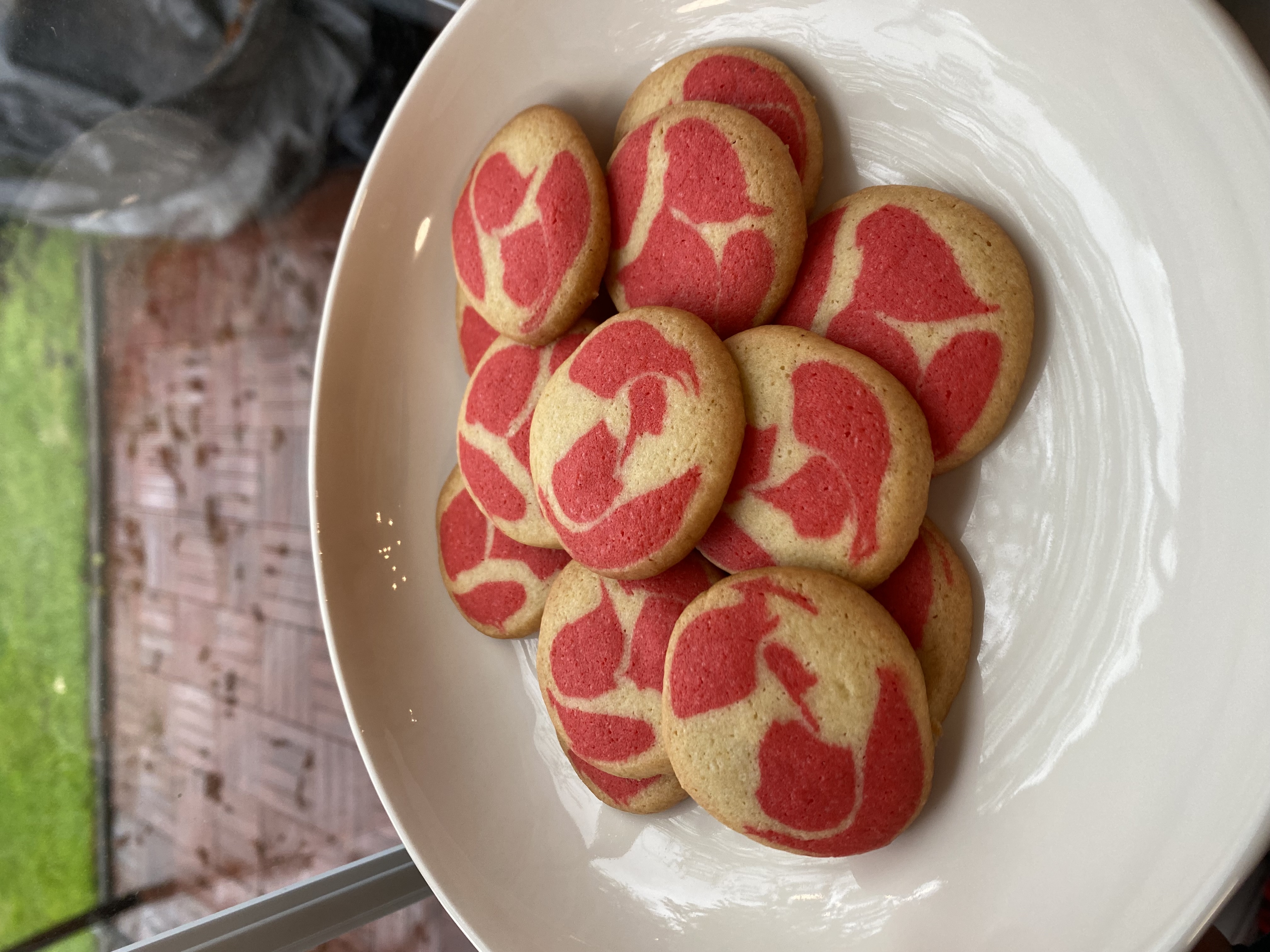A plate of poorly red-marbled cookies.