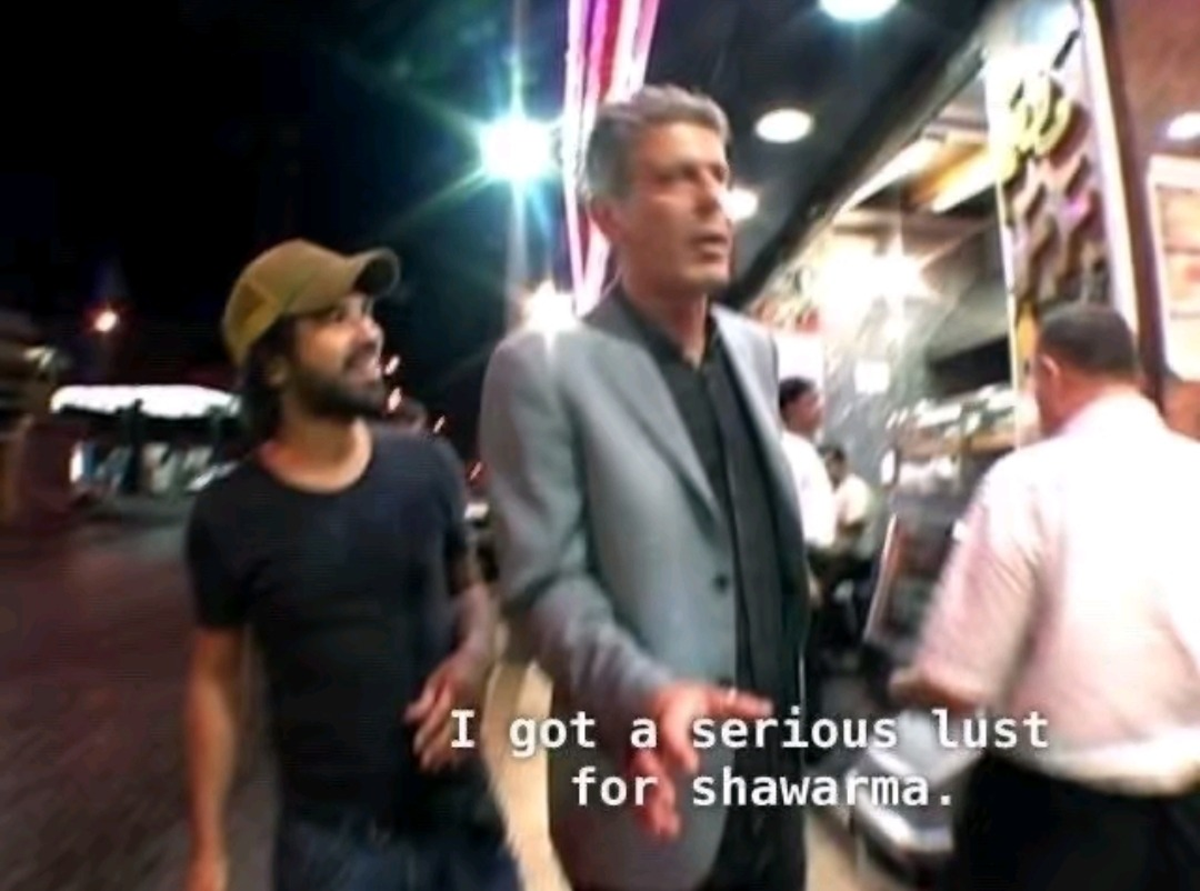 Anthony Bourdain saying 'I got a serious lust for shawarma' mid-episode.