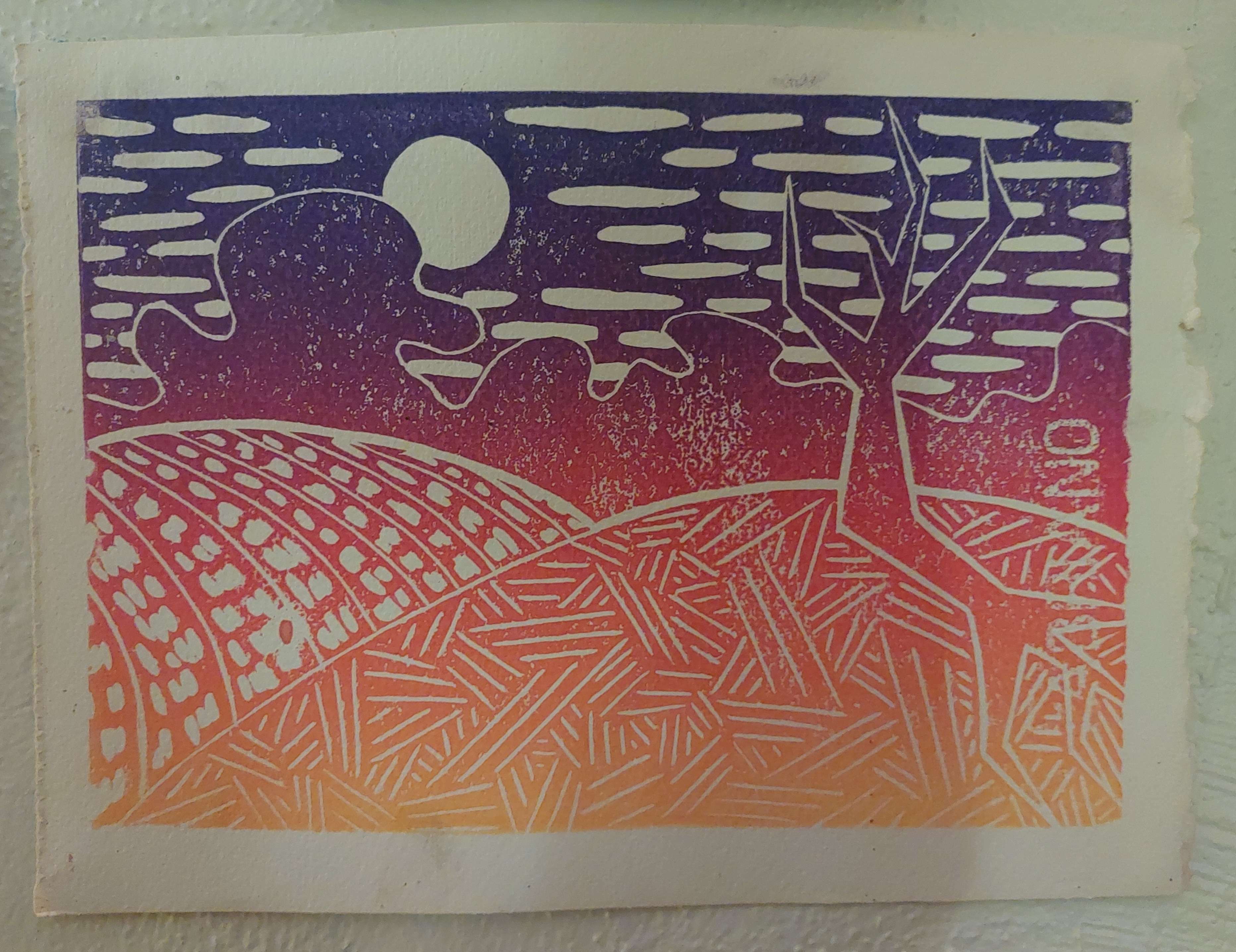 a linoblock print of a sun in the sky over two rolling hills, casting shadows of a barren tree. printed in a purple-orange gradient, it gives the impression of a sun setting into dark night.